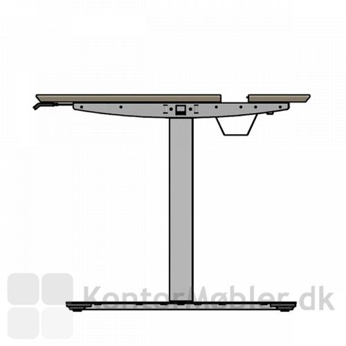 Det yderste af bordpladen på Delta slide hæve sænkebord kan trækkes ud og giver adgang til kablebakken 